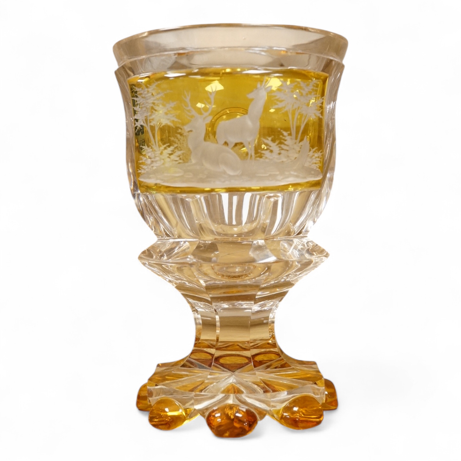 A heavy Bohemian amber flashed glass goblet, late 19th century, decorated with deer, 17cm high